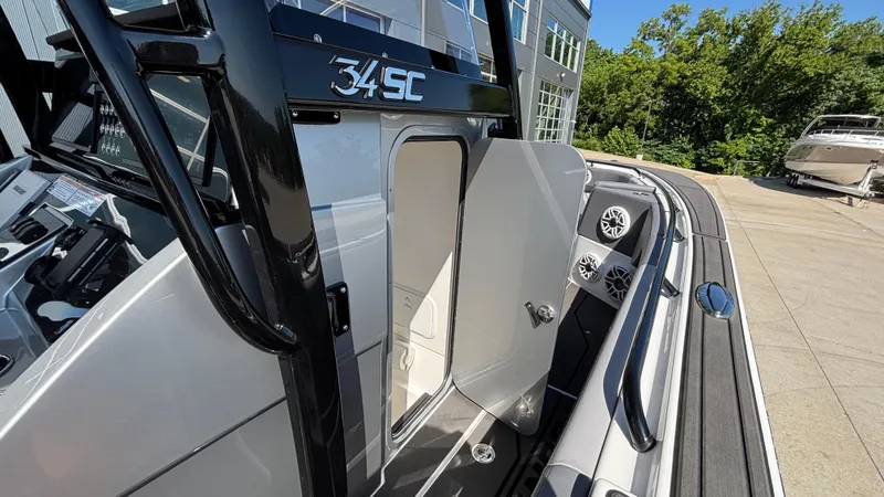 Slide: The Image of 2025 Fountain 34 SC boat with open cabin door and sleek design. - 42