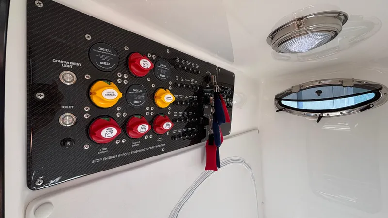 Slide: The Image of Control panel inside 2025 Fountain 34 SC boat, featuring switches and indicators. - 43