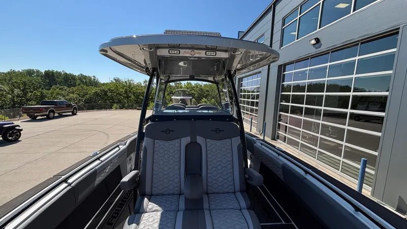 Slide: The Image of 2025 Fountain 34 SC boat interior with modern seating and sleek design. - 49