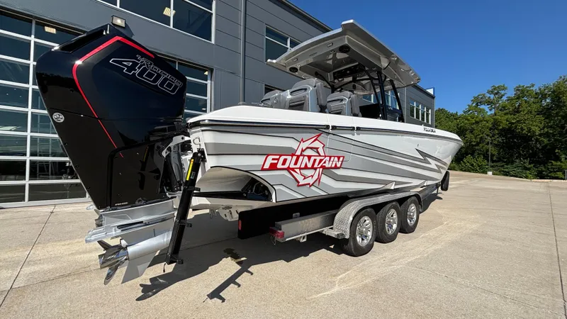 Slide: The Image of 2025 Fountain 34 SC boat with powerful outboard engine on a trailer. - 6