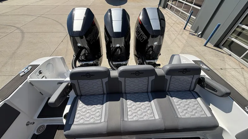 Slide: The Image of 2025 Fountain 34 SC boat with four powerful outboard engines and stylish seating. - 8