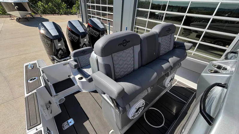 Slide: The Image of 2025 Fountain 34 SC boat with triple outboard engines and luxurious seating. - 9