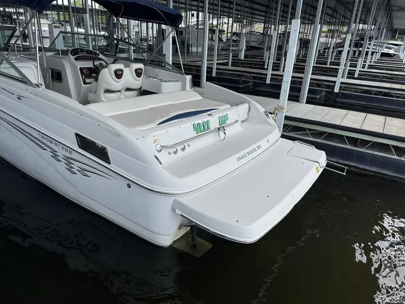 Slide: The Image of 2006 Crownline 290 BR boat docked in marina, rear view. - 3