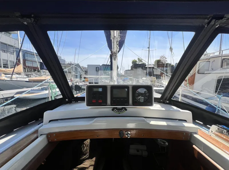 Slide: The Image of Cockpit view of 1986 Pacific Seacraft Dana 24 sailboat in marina. - 10