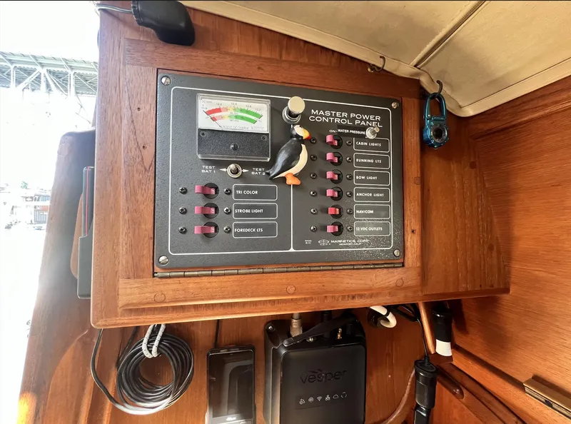 Slide: The Image of Electrical control panel on a 1986 Pacific Seacraft Dana 24 sailboat interior. - 16