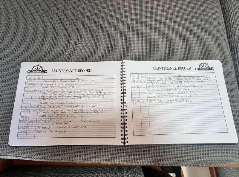 Slide: The Image of Open maintenance record book for 1986 Pacific Seacraft Dana 24 sailboat. - 19