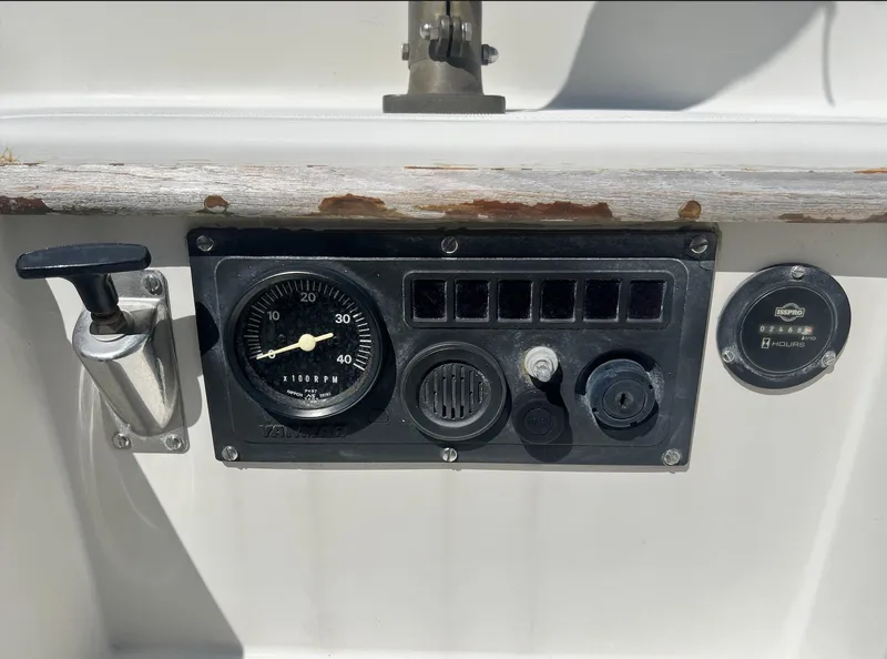 Slide: The Image of Control panel of a 1986 Pacific Seacraft Dana 24 sailboat with gauges and switches. - 9