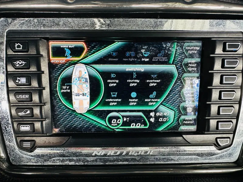 Slide: The Image of 2015 Nautique Super Air Nautique G23 dashboard display with wake surf settings and controls. - 20