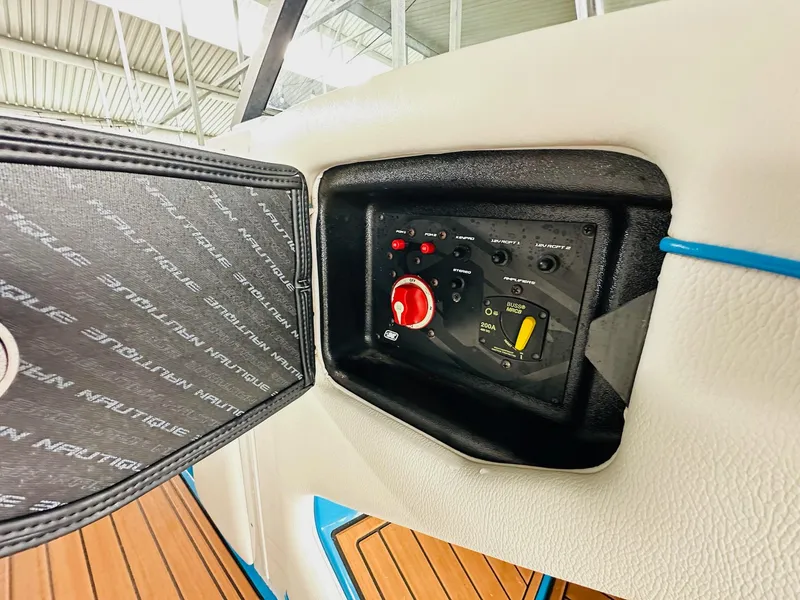Slide: The Image of Control panel of 2015 Nautique Super Air Nautique G23 boat, featuring switches and dials. - 21