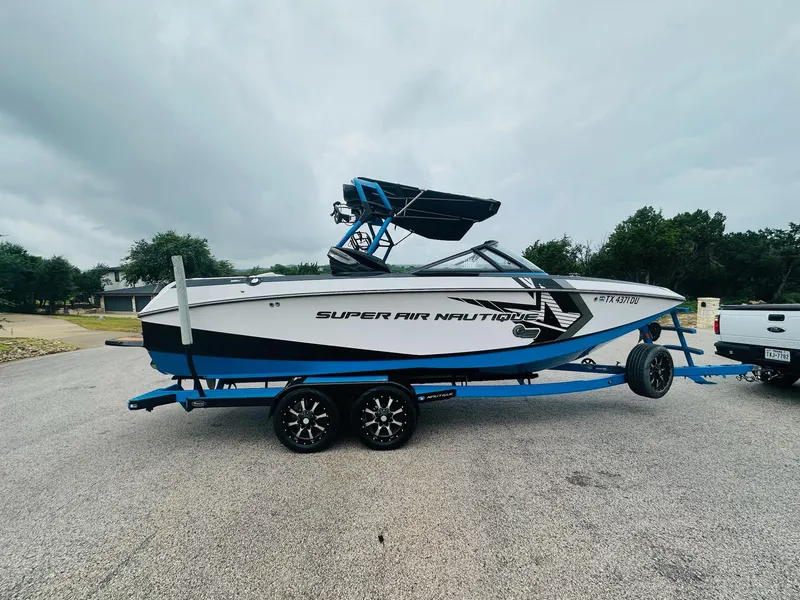 Slide: The Image of 2015 Nautique Super Air Nautique G23 boat on trailer, parked outdoors. - 5