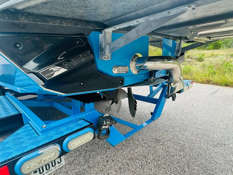 Slide: The Image of 2015 Nautique Super Air Nautique G23 boat trailer with NSS wave plate and exhaust system. - 8