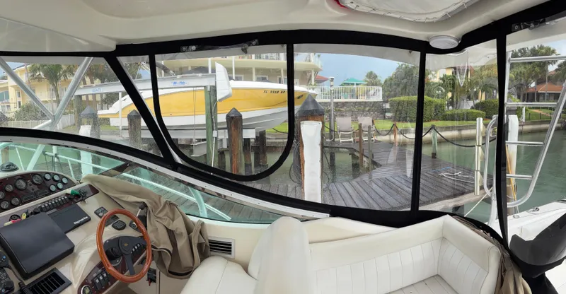 Slide: The Image of Interior view of a 2004 Riviera 4000 yacht docked at a marina. - 19