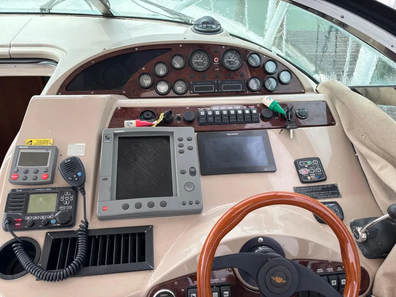 Slide: The Image of Control panel of a 2004 Riviera 4000 boat with navigation and communication equipment. - 21