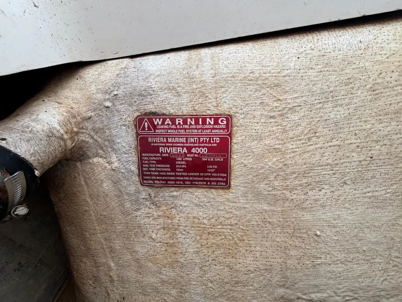 Slide: The Image of Red warning label on a 2004 Riviera 4000 boat fuel tank. - 28