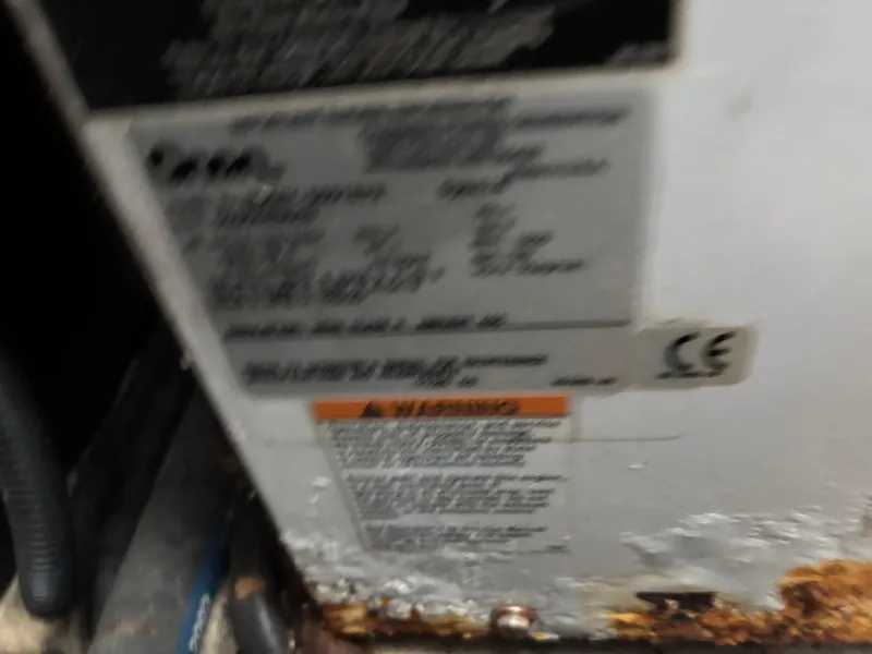 Slide: The Image of Blurred label on a 2004 Riviera 4000, showing text and warning details. - 33