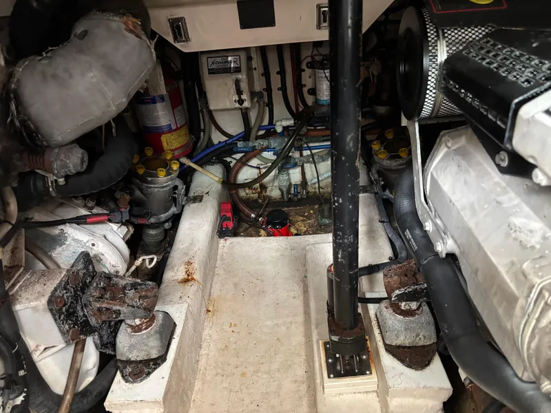 Slide: The Image of Engine room of a 2004 Riviera 4000 boat, showing mechanical components and wiring. - 36
