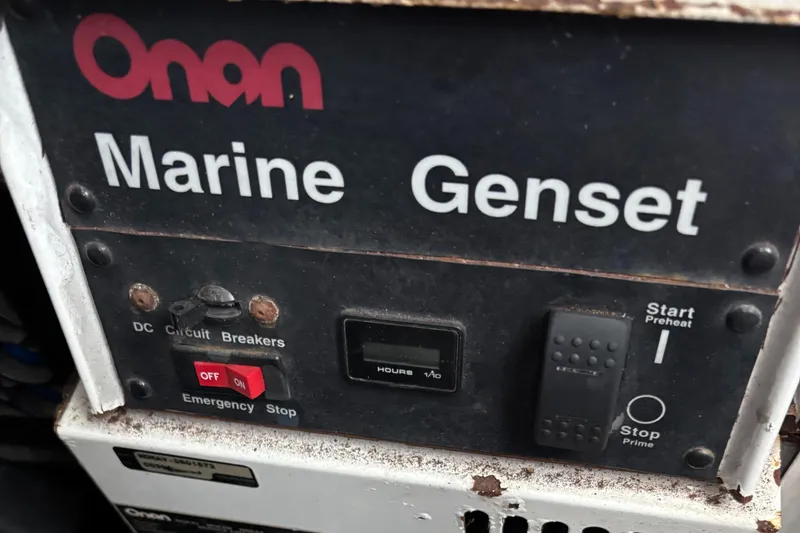 Slide: The Image of Onan Marine Genset control panel on a 2004 Riviera 4000 boat. - 38
