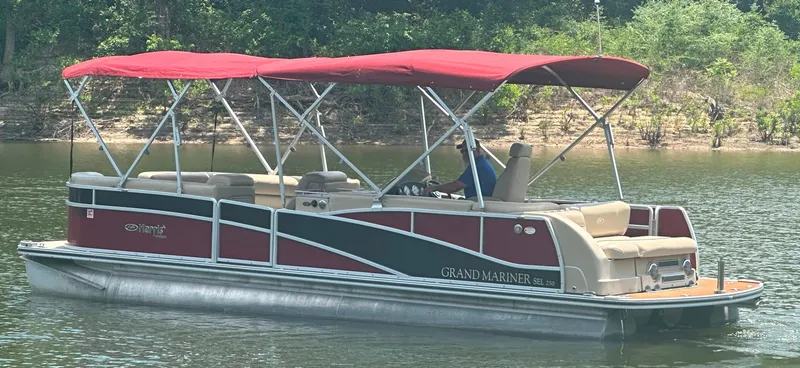 Slide: The Image of 2012 Harris FloteBote Grand Mariner SEL 250 pontoon boat on a calm lake. - 2