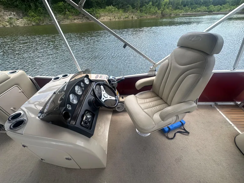 Slide: The Image of Captain's chair and control panel on 2012 Harris FloteBote Grand Mariner SEL 250 pontoon boat. - 20