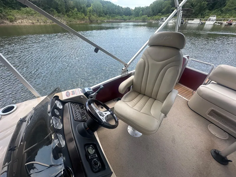 Slide: The Image of 2012 Harris FloteBote Grand Mariner SEL 250 interior with captain's chair and steering console. - 21