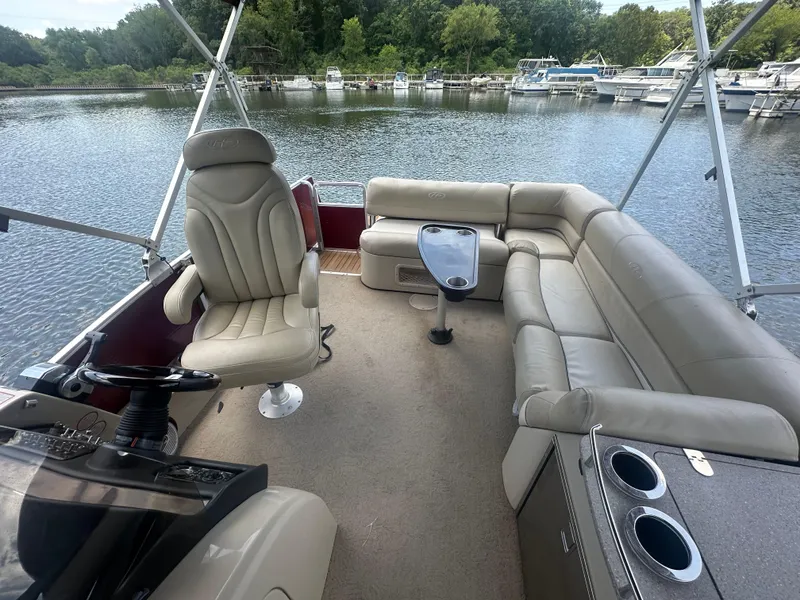 Slide: The Image of 2012 Harris FloteBote Grand Mariner SEL 250 interior with plush seating and steering wheel. - 22