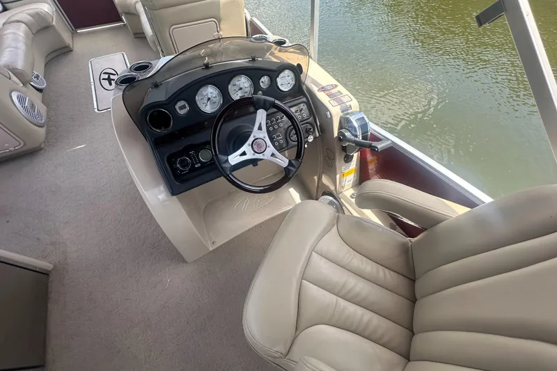 Slide: The Image of Interior view of 2012 Harris FloteBote Grand Mariner SEL 250 boat cockpit. - 23