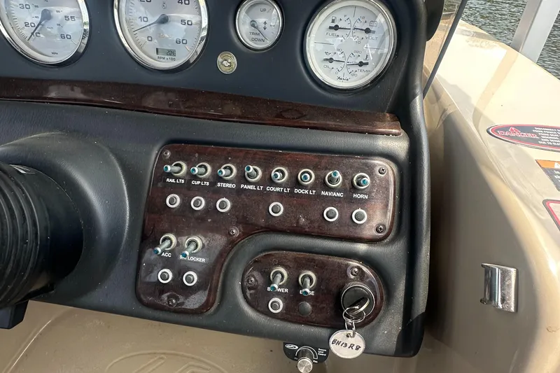 Slide: The Image of Control panel of 2012 Harris FloteBote Grand Mariner SEL 250 with gauges and switches. - 26