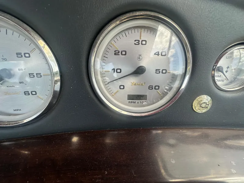 Slide: The Image of Dashboard gauges of a 2012 Harris FloteBote Grand Mariner SEL 250 boat. - 28