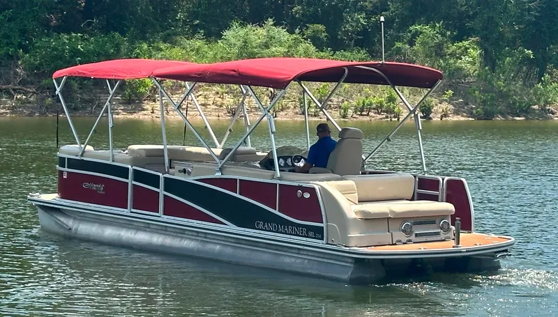 Slide: The Image of 2012 Harris FloteBote Grand Mariner SEL 250 pontoon boat on a calm lake. - 3
