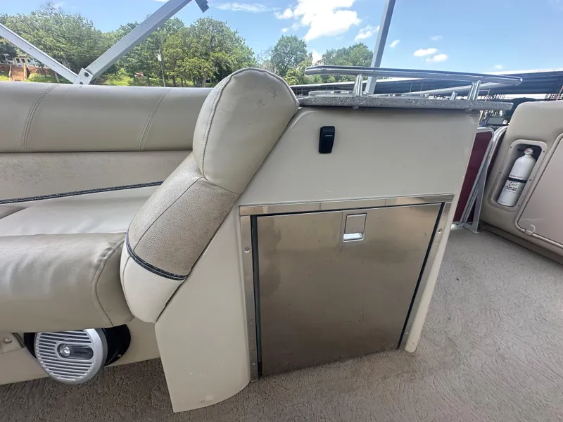 Slide: The Image of Interior of 2012 Harris FloteBote Grand Mariner SEL 250 with seating and storage compartment. - 30