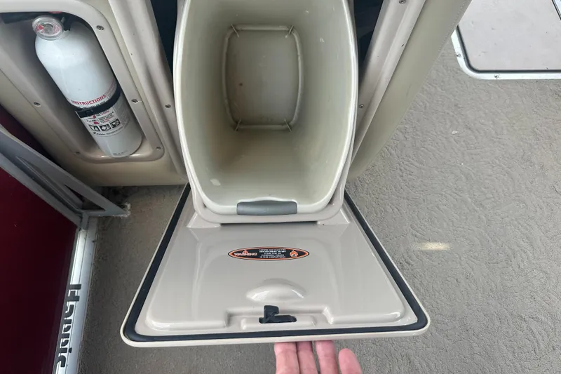 Slide: The Image of Harris FloteBote Grand Mariner SEL 250 storage compartment with fire extinguisher, 2012 model. - 34