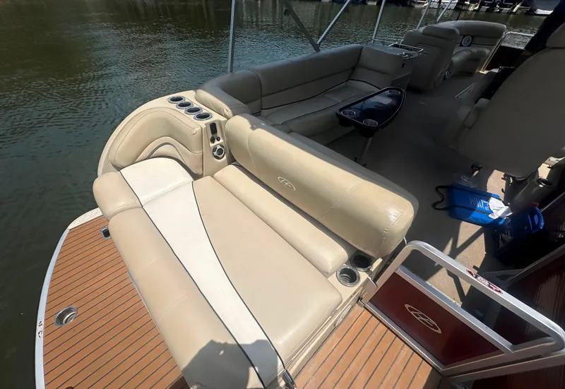 Slide: The Image of 2012 Harris FloteBote Grand Mariner SEL 250 interior with beige seating and wood deck. - 36