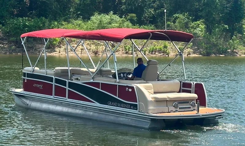 Slide: The Image of 2012 Harris FloteBote Grand Mariner SEL 250 pontoon boat on a calm lake. - 4