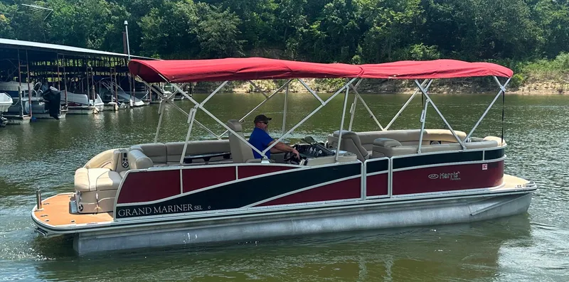 Slide: The Image of 2012 Harris FloteBote Grand Mariner SEL 250 pontoon boat on a lake with red canopy. - 6
