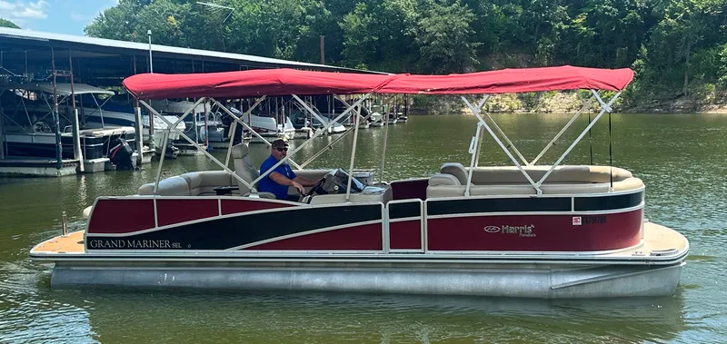 Slide: The Image of 2012 Harris FloteBote Grand Mariner SEL 250 pontoon boat with red canopy on a lake. - 7