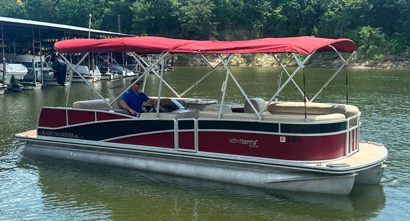 Slide: The Image of 2012 Harris FloteBote Grand Mariner SEL 250 pontoon boat with red canopy on a lake. - 8