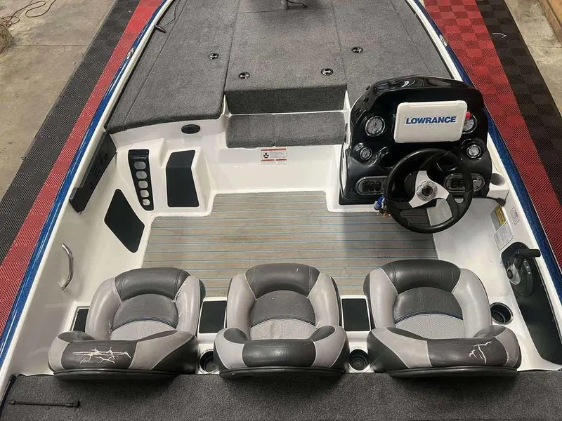 Slide: The Image of 2015 Nitro Z Series Z-7 boat interior with steering wheel and three seats. - 3