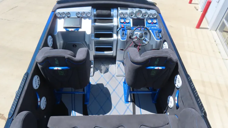 Slide: The Image of 2005 Cigarette 39' Top Gun Unlimited boat interior with modern dashboard and seating. - 10