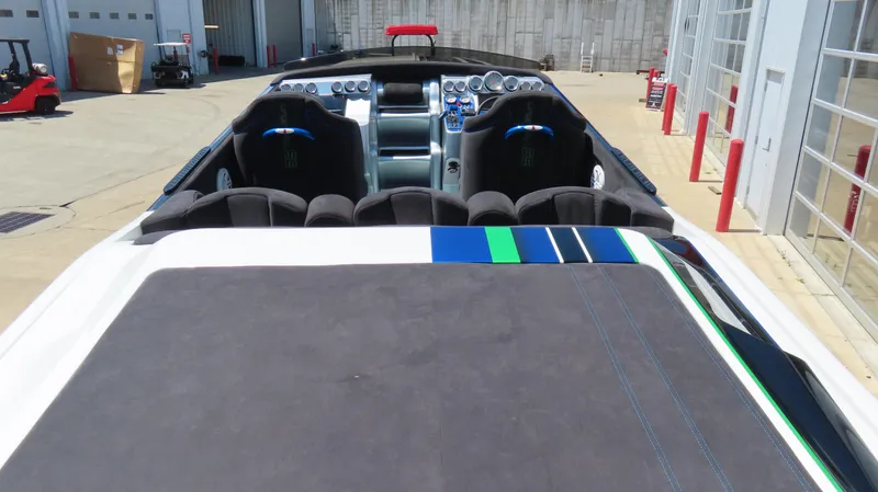 Slide: The Image of 2005 Cigarette 39' Top Gun Unlimited boat interior with sleek design and modern controls. - 11