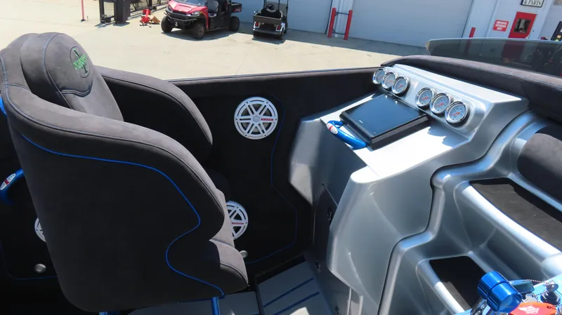 Slide: The Image of 2005 Cigarette 39' Top Gun Unlimited boat interior with gauges and seating. - 13