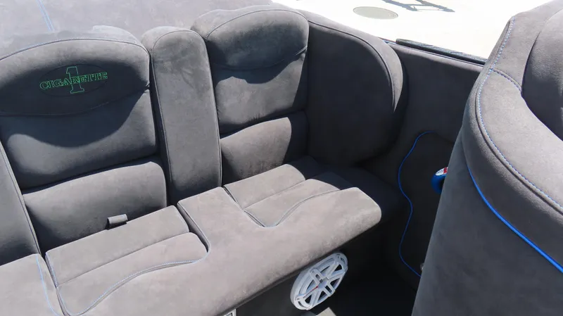Slide: The Image of 2005 Cigarette 39' Top Gun Unlimited interior with gray seating and blue accents. - 16