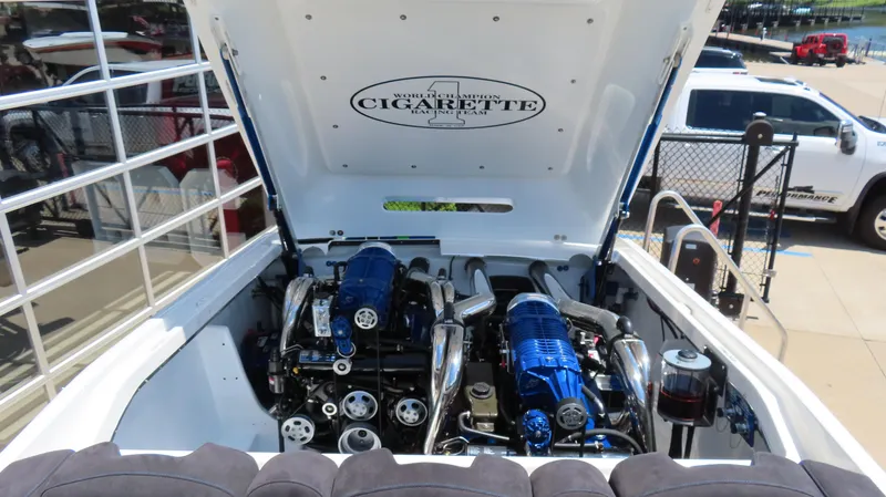 Slide: The Image of 2005 Cigarette 39' Top Gun Unlimited boat engine compartment with dual engines. - 20