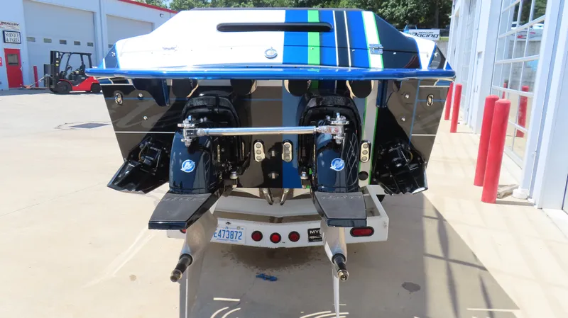Slide: The Image of Rear view of 2005 Cigarette 39' Top Gun Unlimited boat with dual engines. - 6