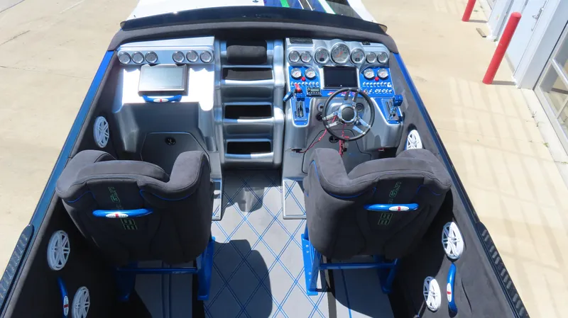 Slide: The Image of 2005 Cigarette 39' Top Gun Unlimited boat cockpit with dual seats and advanced controls. - 9