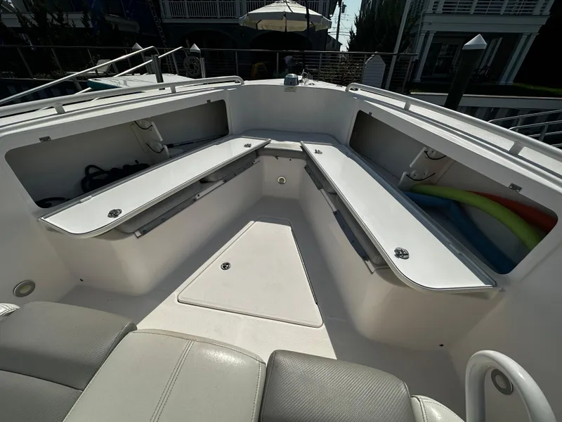Slide: The Image of 2012 Everglades 295 Center Console boat interior with open storage compartments. - 12