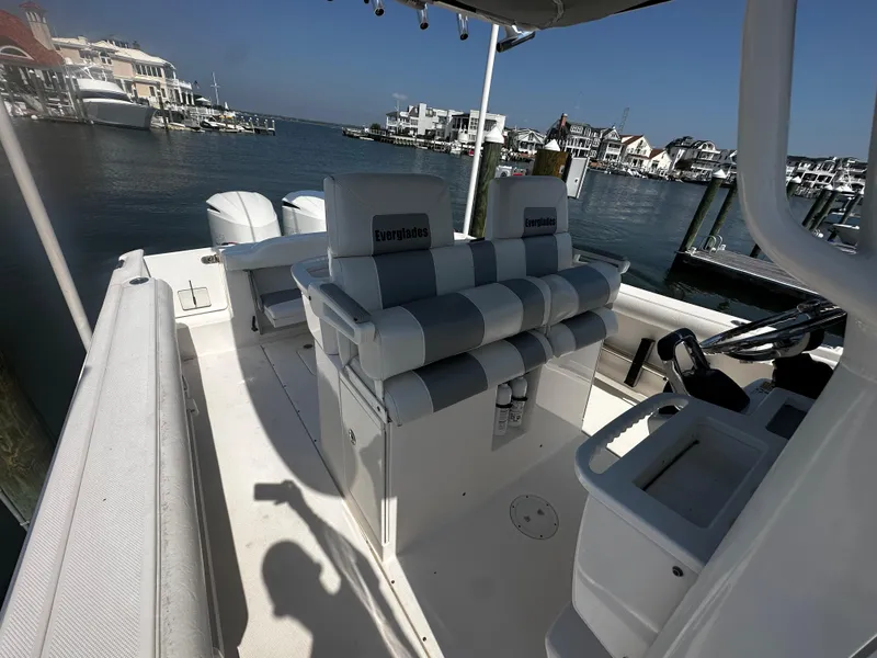 Slide: The Image of 2012 Everglades 295 Center Console boat interior with waterfront view. - 19