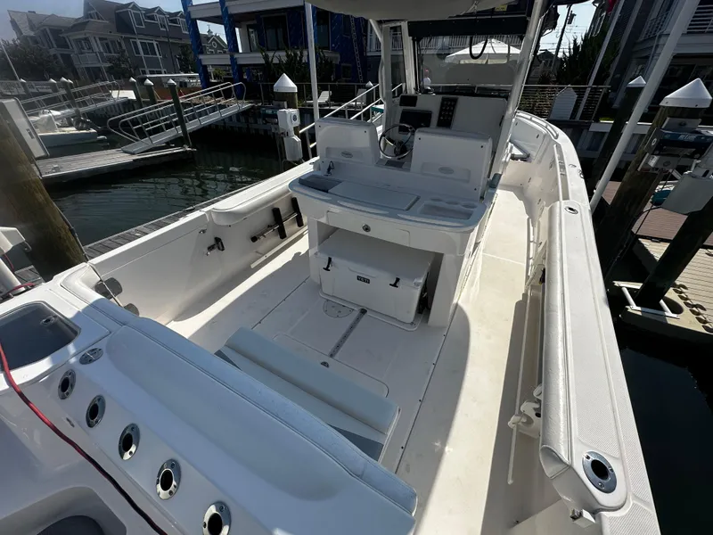 Slide: The Image of 2012 Everglades 295 Center Console boat docked at a marina. - 21
