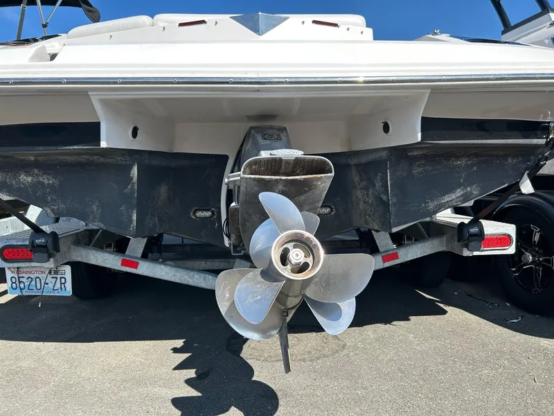 Slide: The Image of 2016 Regal 2250 Cuddy boat propeller and stern on trailer. - 10