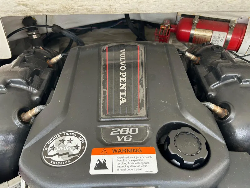 Slide: The Image of Volvo Penta 280 V6 engine in 2016 Regal 2250 Cuddy boat, with warning label. - 13