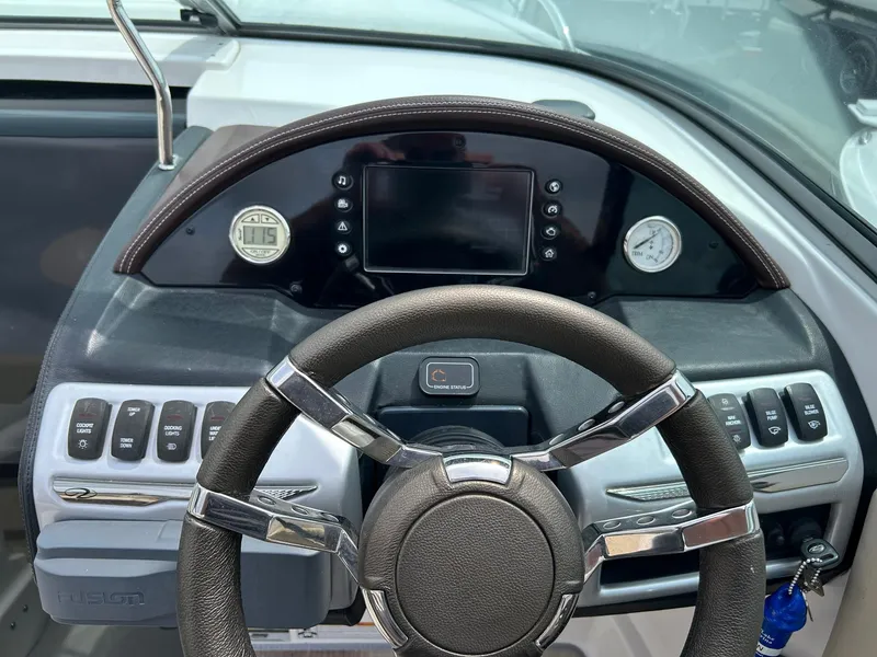 Slide: The Image of Steering wheel and dashboard of a 2016 Regal 2250 Cuddy boat. - 20